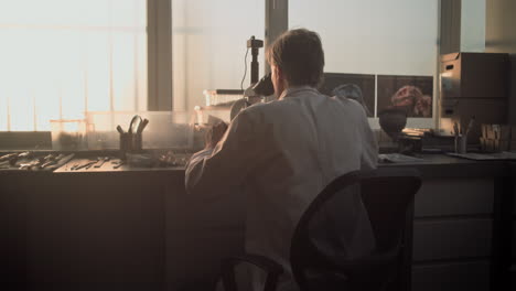 scientist working with microscope in lab