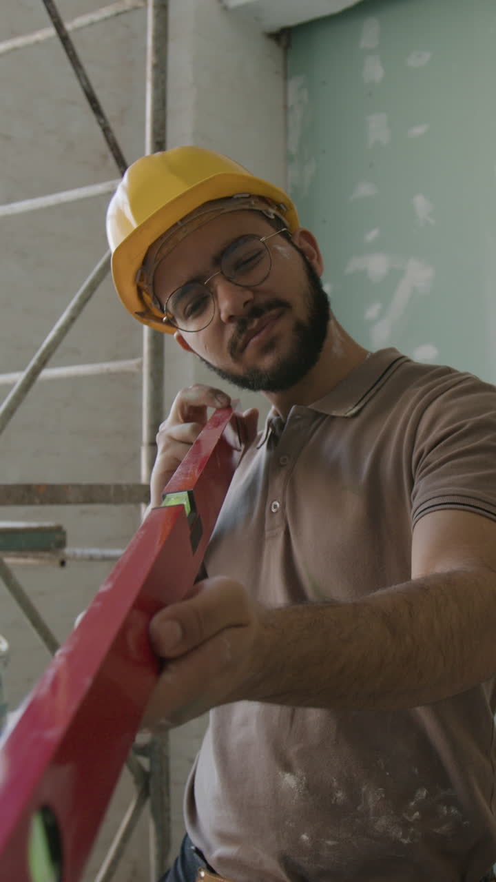 Construction Worker Using Level