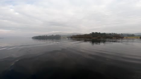 misty scene over lake windermere in the english lake district national park