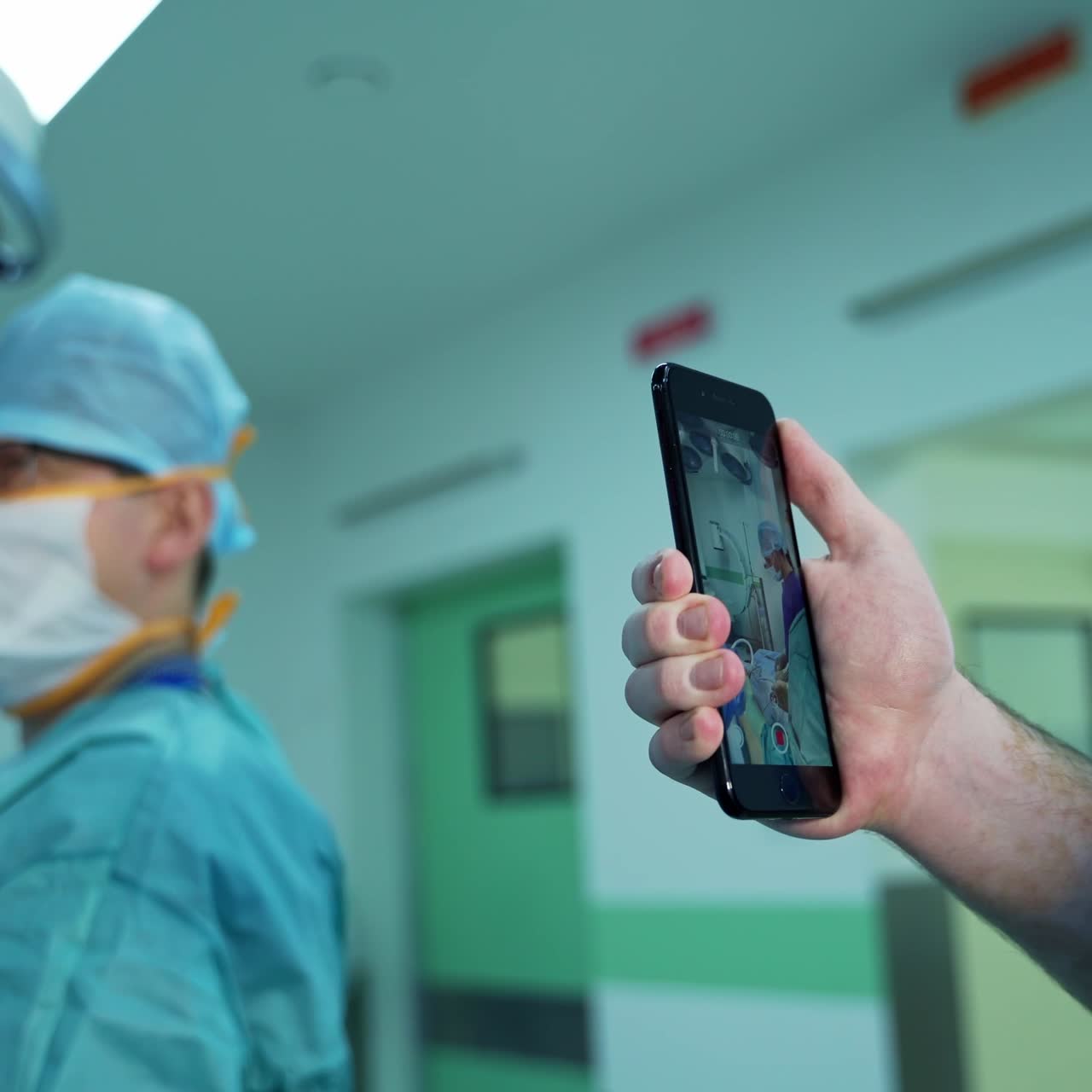 Doctor surgery in medical mask working in hospital. Handsome surgeon working in emergency ward