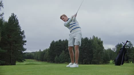 man playing golf on a golf course