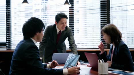 asian businessperson in a meeting.