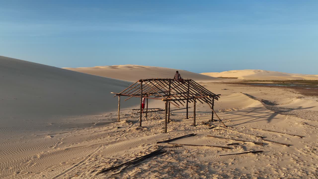 Indigenous People Constructing A Wood Frame Of A House In The Sand Dunes Of The Parnaíba River Delta, Brazil. Aerial Shot