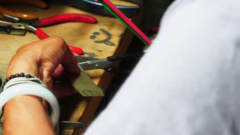 Craftswoman-working-in-workshop