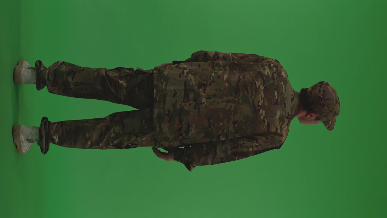 Full Body Back View Of Asian Male Soldier Standing And Looking Around To Protects His Country From The War On The Green Screen Background