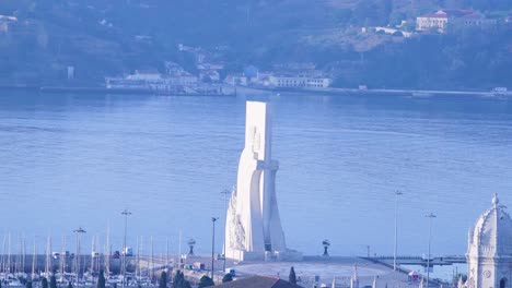 timelapse of monument of the discoveries at sunrise, lisbon, portugal, europe, 4k aerial drone view