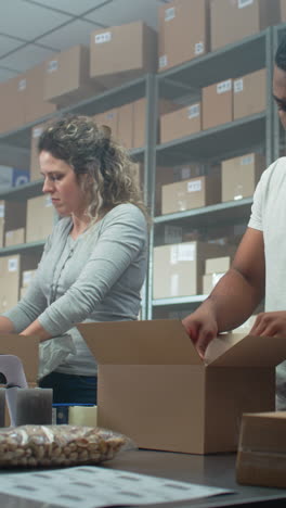 warehouse workers packing boxes