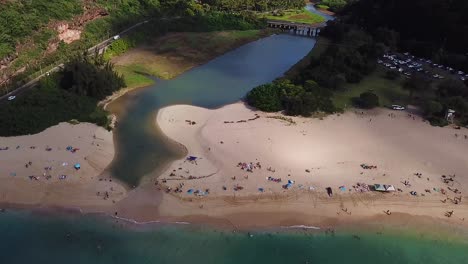 Panning-Down-drone-shot-of-Waimea-Bay-and-Waimea-Valley