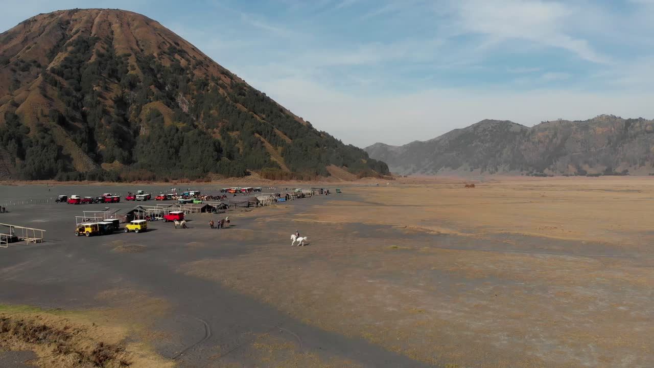 Batok volcano eruption with jeeps, East Java, Indonesia