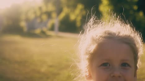 little girl runs with butterfly net in park slow motion