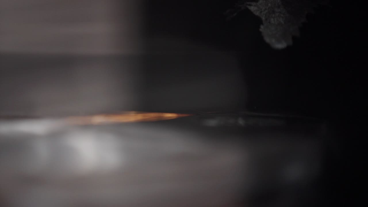 Slow motion sparks from metal grinding machine. Industrial concept grinding metal with sparks. Metal milling machine during grinding out the metal detail in factory. Metal grinding machine with sparks