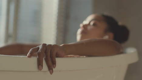 woman relaxing in a warm bath
