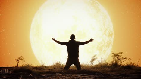 man praying to the moon