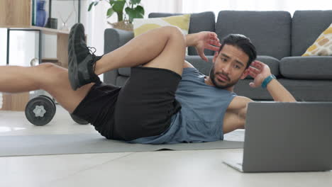 Fitness-man,-home-workout-and-laptop