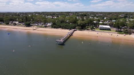 scenic coastline view of nielsens park and torquay beach jetty in hervey bay, australia.