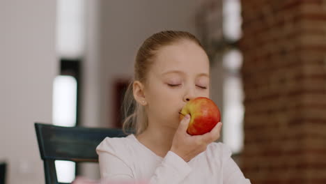 young girl eating an apple