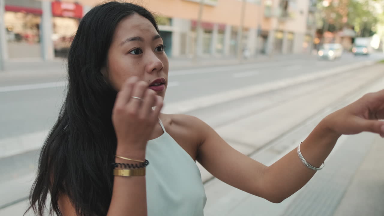 Woman standing on a city street