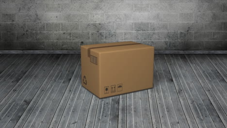 animation of cardboard box falling on grey wooden floor with grey bricks in background