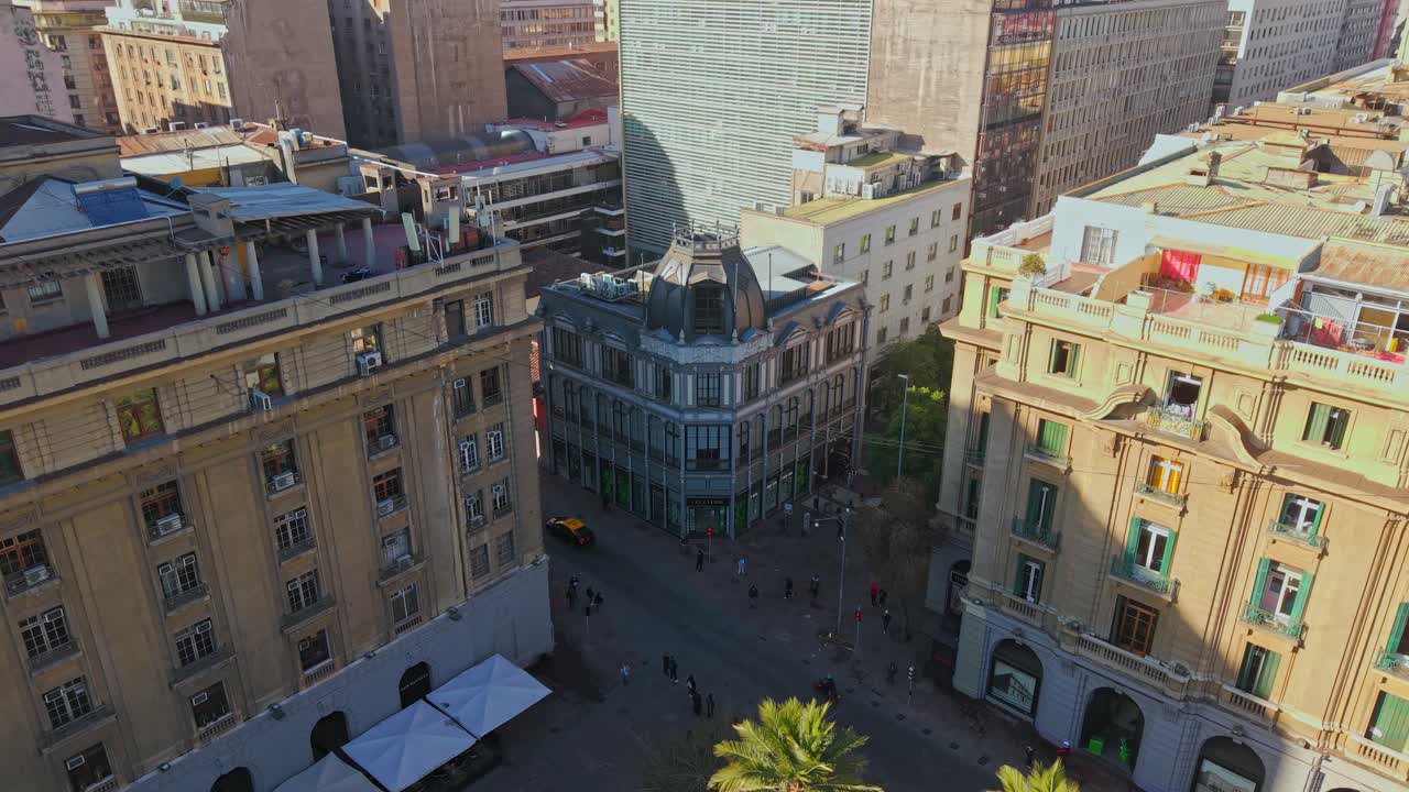 Aerial view of the Edwards commercial building in downtown Santiago, Chile, in the Plaza de Armas, heritage architecture on a sunny workday, now a pharmacy