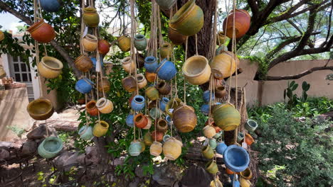 Tubac-Arizona,-colorful-ceramic-pottery-for-sale-in-a-store,-panning-shot