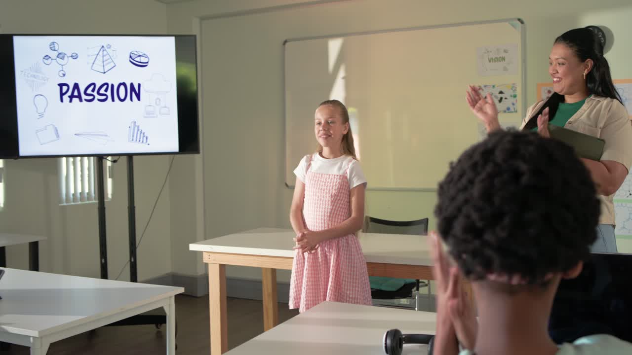 Youth female student in pink dress giving PASSION presentation in classroom while teacher clapping