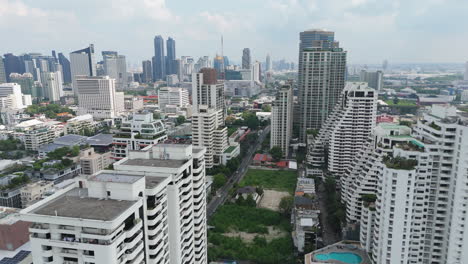 bangkok skyline with commercial buildings, condominiums, and corporate offices in thailand. - aerial shot