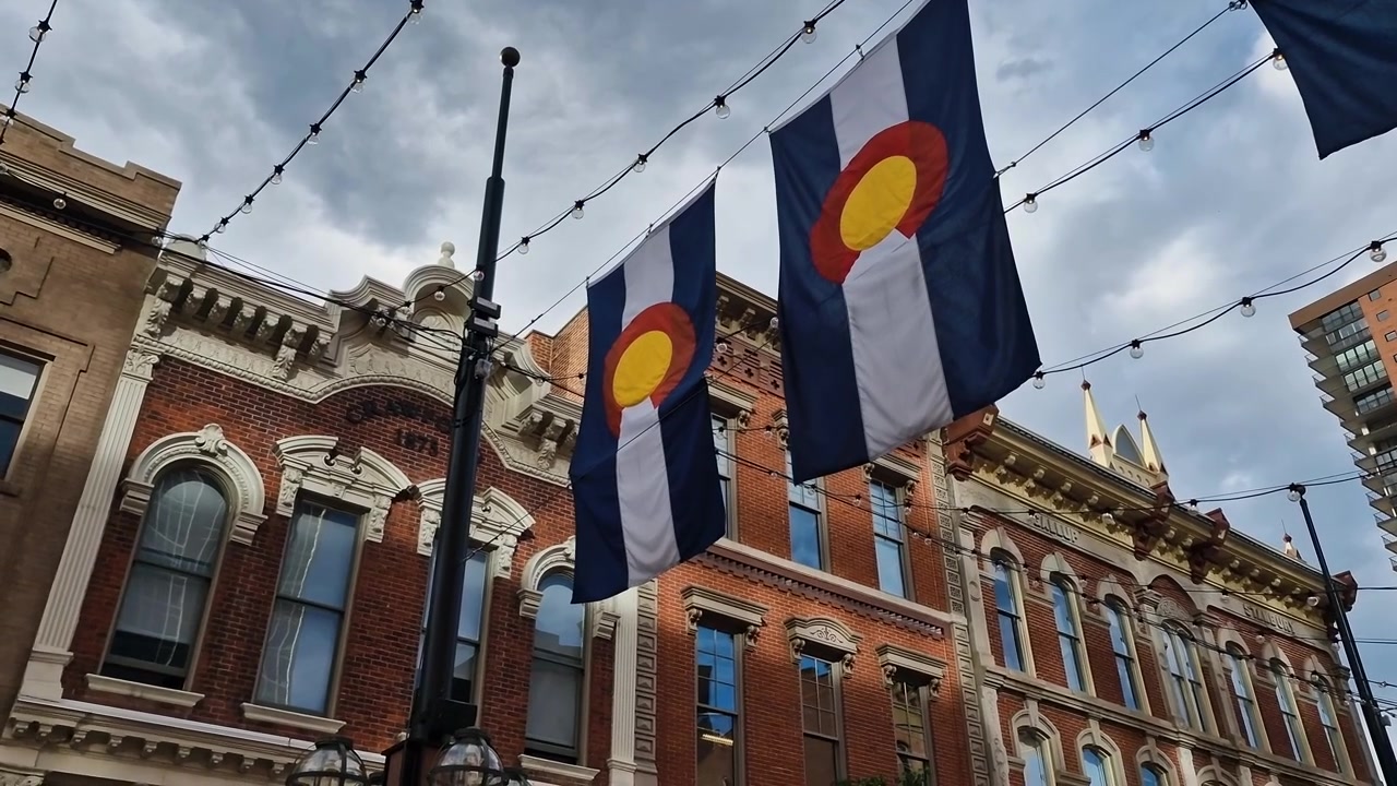 Colorado State Flags Hanging Between Historic Buildings on Larimer Square, Downtown Denver USA