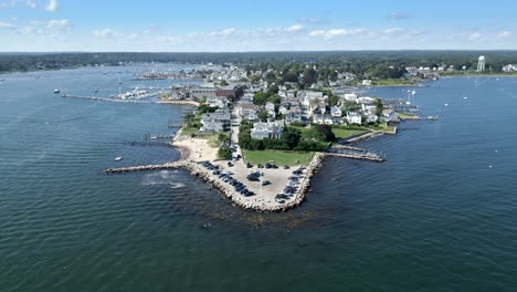 Static-aerial-view-of-Dubois-Point-Stonington-Connecticut-on-sunny-day,-currents-ripple-across-ocean-surface