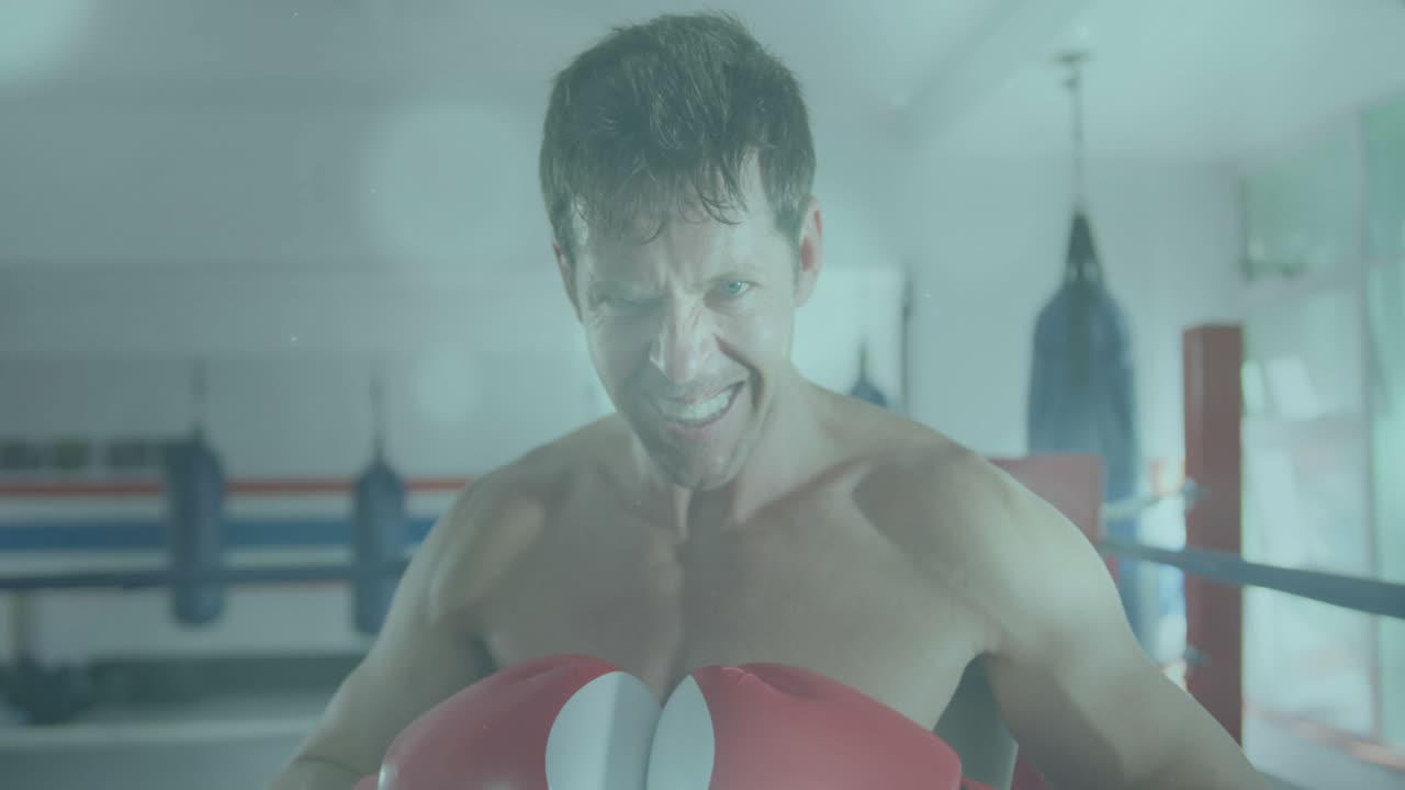 Male boxer breathing, leaning, raising red gloves into guard, fitness overlay lines signaling focus