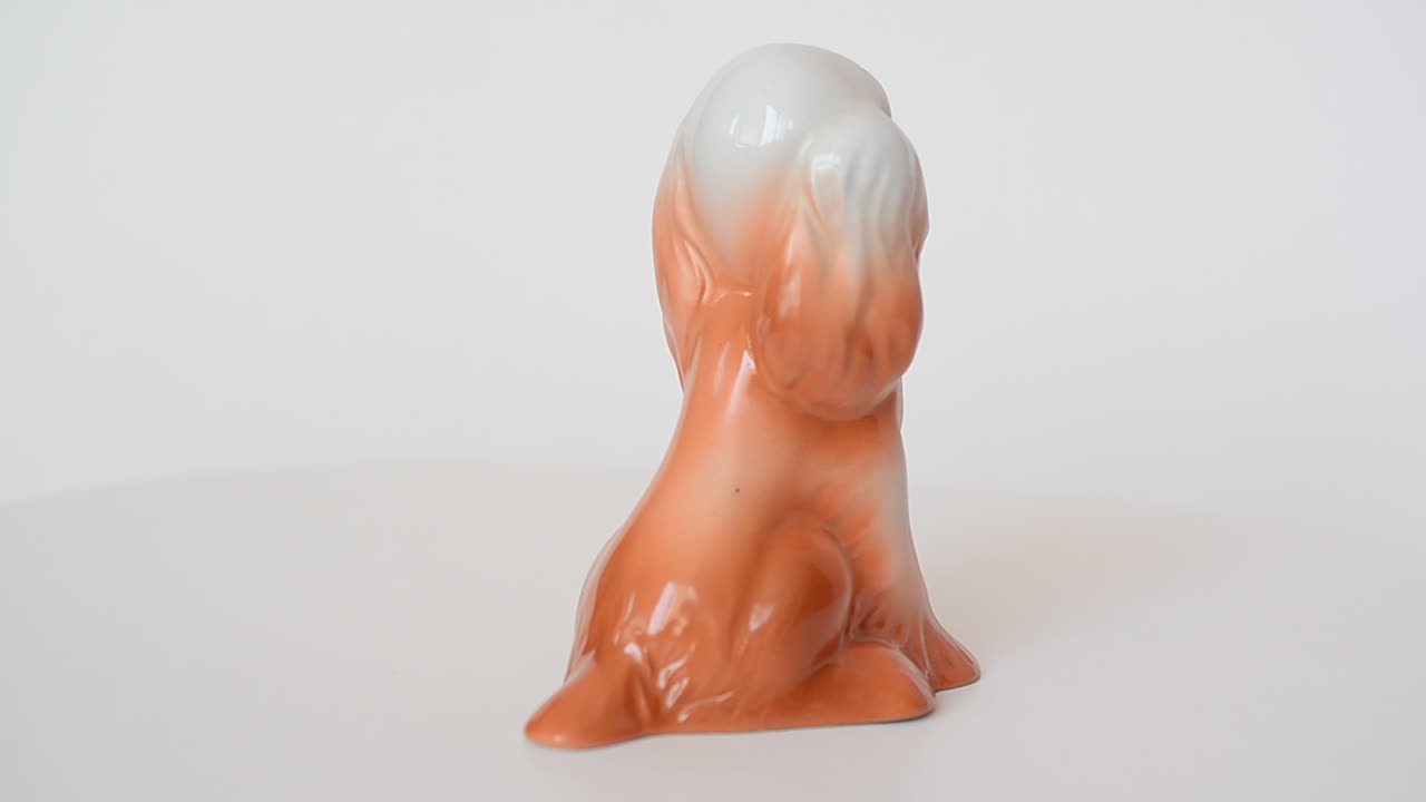 Shooting of a figurine of a spaniel. Shooting of a figurine