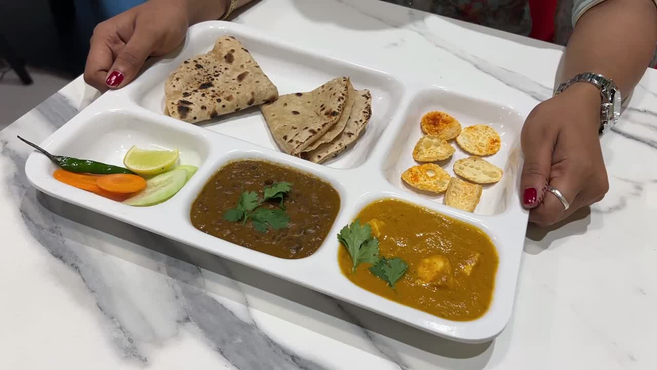 Veg Marwari Thali with chapati, paneer, dal tarka, salad served in a restaurant in India