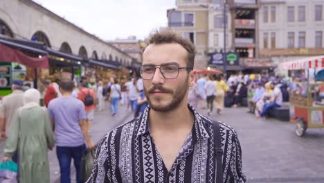 young man walking on the streets of istanbul in slow motion.