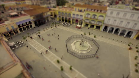 stop motion, high rise view of people and families walking in a town square