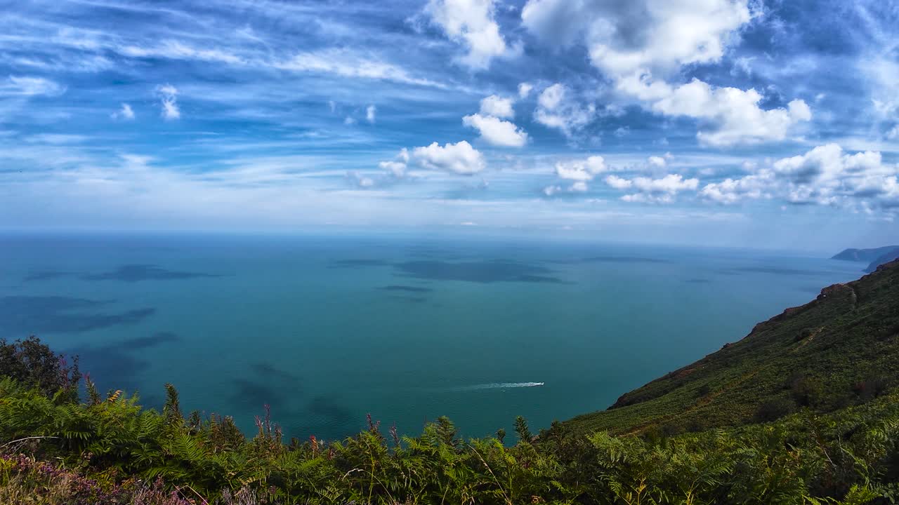 View of Bristol Channel Sea from Exmoor Coast Path with Lone Speed Boat Powering Along the Ocean