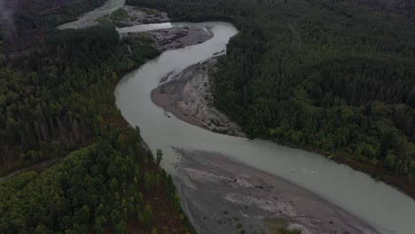 revealing shot of the elaho river in the heart of british columbia mountains