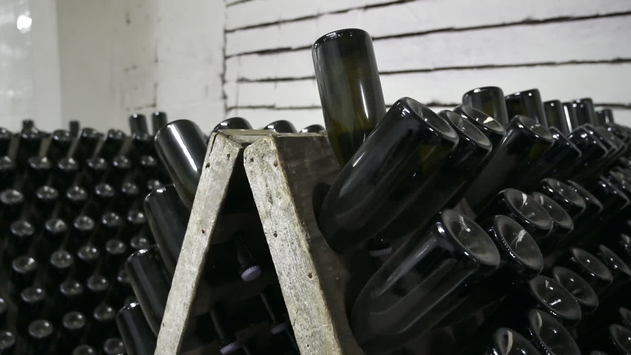 Wine bottles in a winery cellar underground