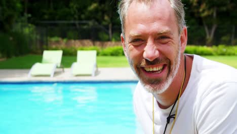 happy lifeguard at pool side