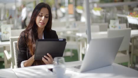 Attractive-businesswoman-using-a-tablet-pc