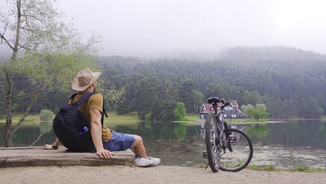 Adventurer-sitting-in-beautiful-nature-landscape.