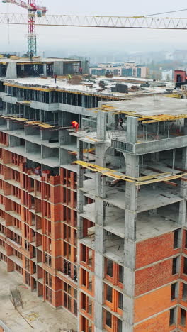 construction of a residential apartment complex. aerial view. vertical video