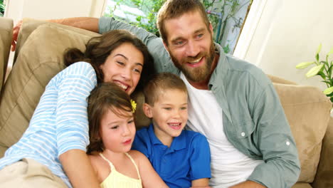 happy family sitting on couch