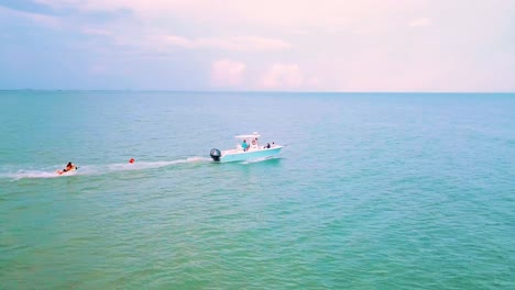 Tube-being-pulled-by-boat