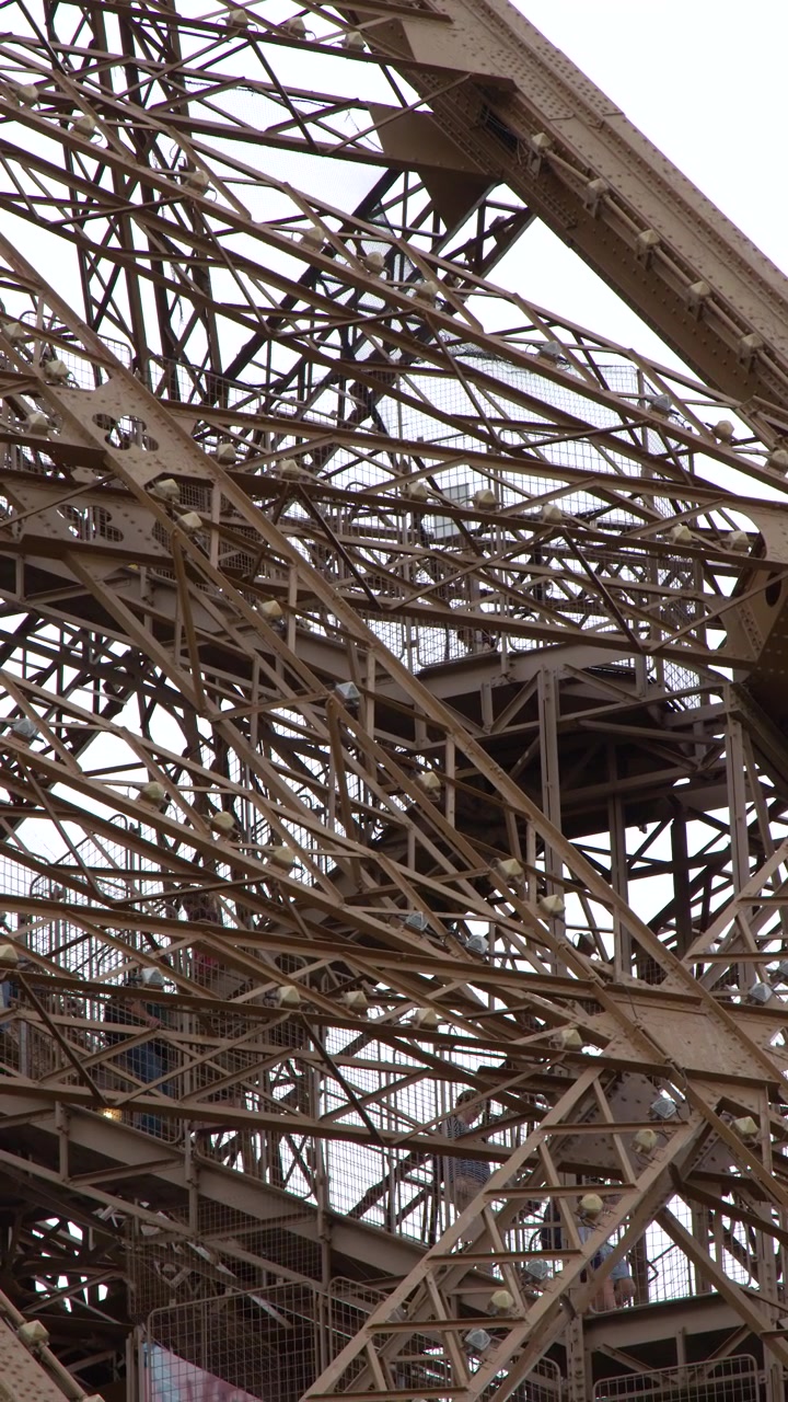 Close-up static shot of the complex metal framework and architectural engineering of a famous landmark