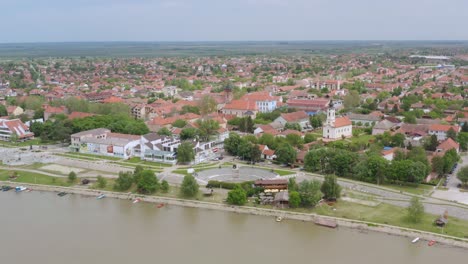 aerial: historical serbia town, residential district on riverside