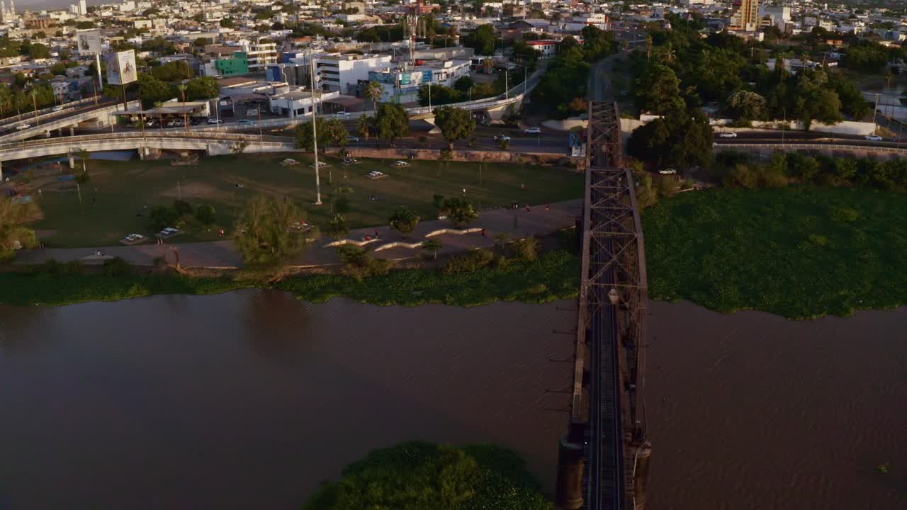 Right to left drone shot of an old train bridge, an iconic place in the capital of the state of Sinaloa, Culican