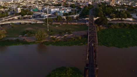 right to left drone shot of an old train bridge, an iconic place in the capital of the state of sinaloa, culican