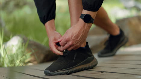 fitness, park and man tie shoe for running