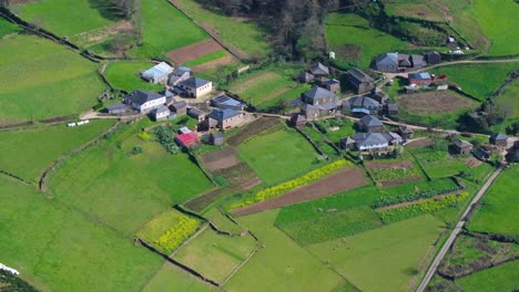 houses on field in spanish village in a fonsagrada, lugo, spain