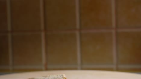 Toasts-are-beautiful-presented-on-a-wooden-platter-in-a-kitchen---Tilt-Shot