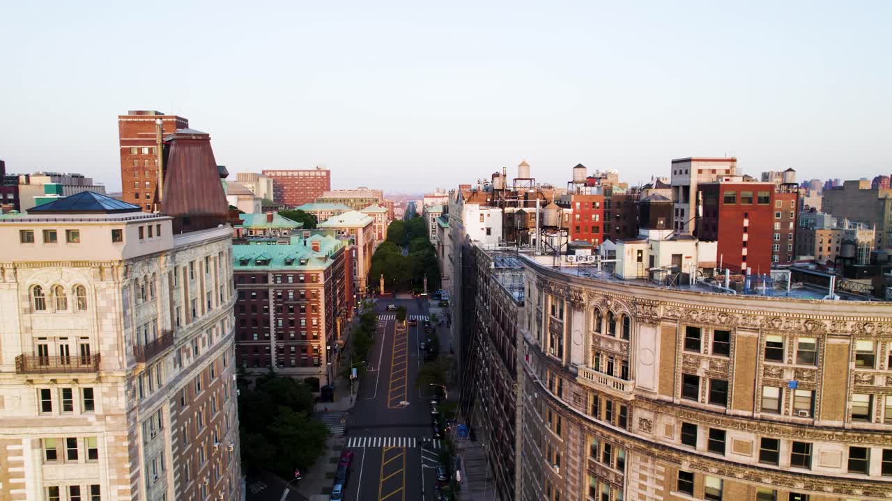 Aerial shot up New York City's 116th St. Beautiful old apartment buildings near Columbia University